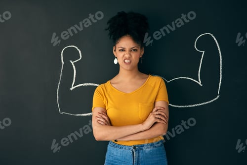 Preview: Shot of a woman posing with a chalk illustration of flexing muscles against a dark background