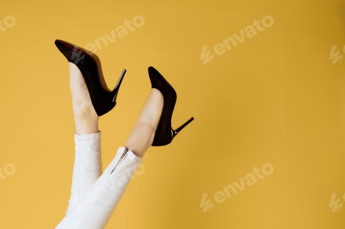 Preview: Woman's Legs Wearing Stylish Black High Heels