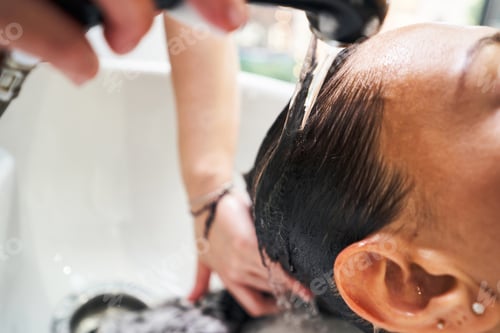 Preview: Close up of female washing her hair