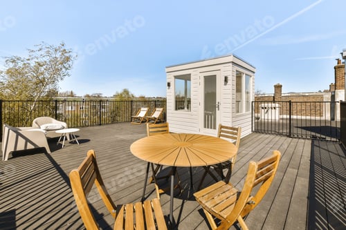 Preview: a patio with a table and chairs on a balcony