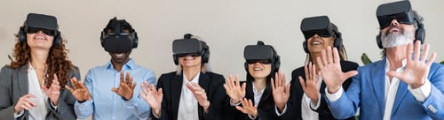 Preview: Group of multiracial colleagues meeting in office using VR headset - metaverse concept -