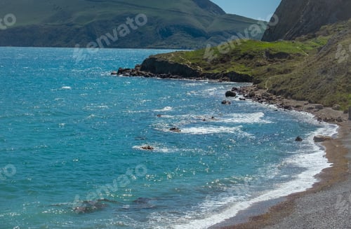 Preview: Beautiful green slopes of the mountains by the sea.