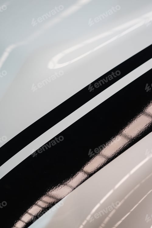 Preview: Detail of black stripes a white metallic surface
