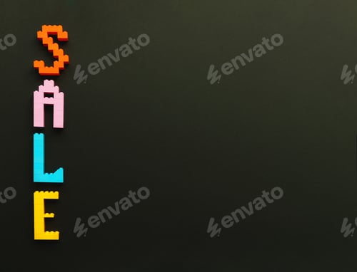 Preview: The inscription sale is laid out by the designer on a black background. Multicolored letters.