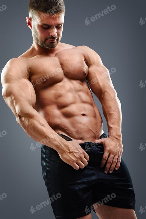 Preview: Bodybuilder man showing his abs