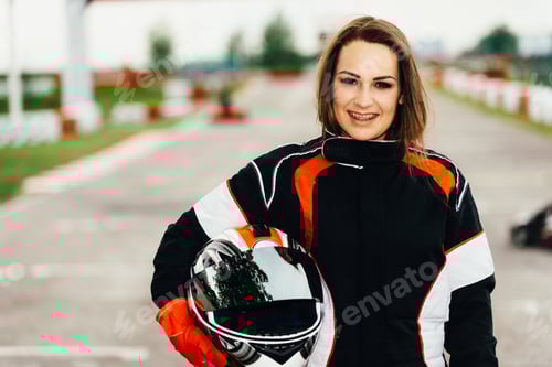 Preview: Enthusiastic Woman in Racing Gear on the Track