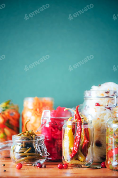 Preview: Probiotics food background. Korean carrot, kimchi, beetroot, sauerkraut, pickled cucumbers in glass