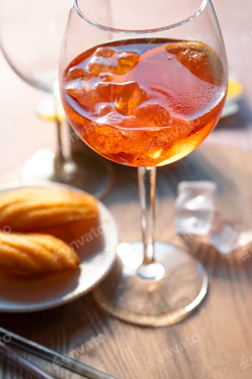 Preview: Aperol and madeleines in the afternoon light
