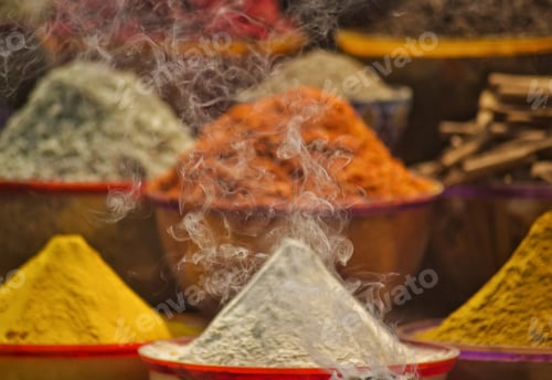 Preview: Colorful Spices at traditional spice market with smoky incense burning