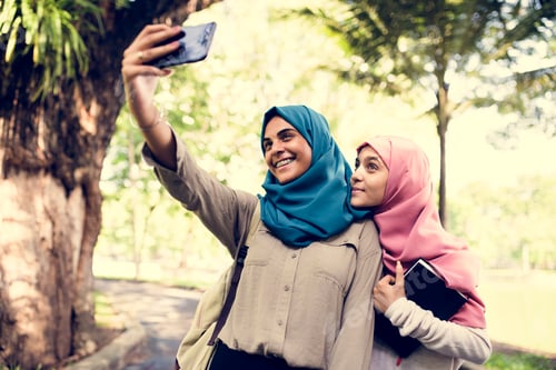 Preview: Group of students using mobile phone