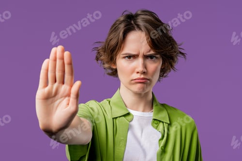 Vista previa: Uninterested woman disapproving with NO sign gesture. Keep your distance, enough