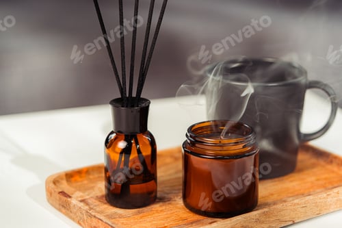 Preview: Aromatic reed freshener and candle on table in room