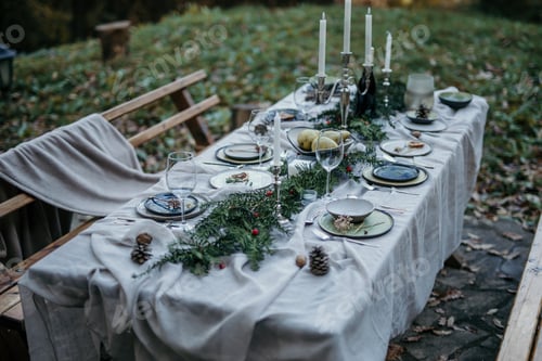 Preview: Festive table is ready for christmas celebration in a garden