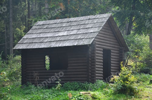Preview: Small natural house, which is built of wood. The building is located in the forest