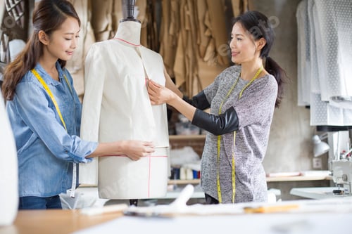Preview: Two female fashion designers working in studio