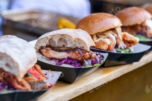 Preview: Chicken burgers displayed on a market stall