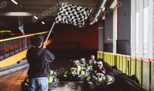 Preview: Checkered Flag Waving to Signal the Start of Go-Kart Race