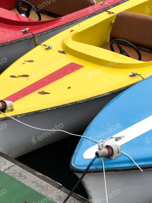 Preview: Bumper boats moored at a dock by water