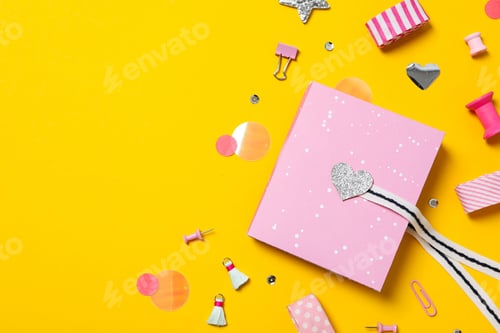 Preview: Scrapbooking, on a yellow background, flat lay.