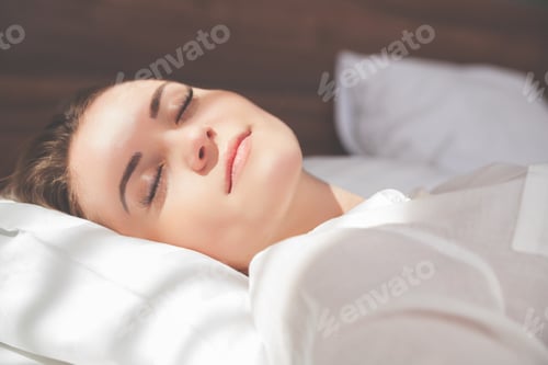 Preview: Pretty woman on bed in modern apartment smiling after wake up