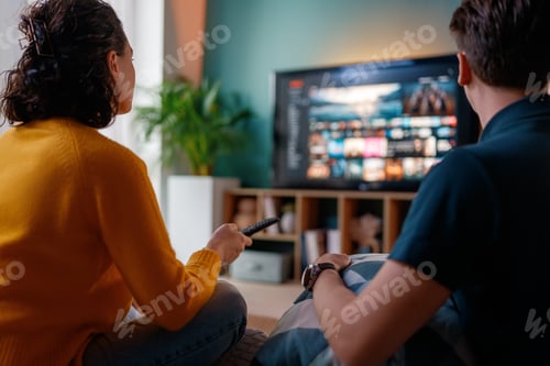Preview: family watching TV at home