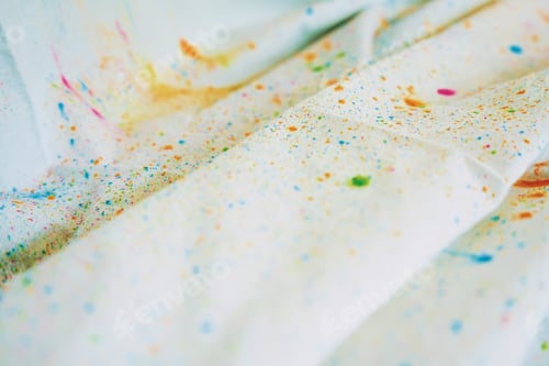 Preview: Holi dust splash over a white curtain