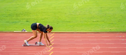 Preview: Asian young sportswoman sprint on a running track outdoors on stadium.