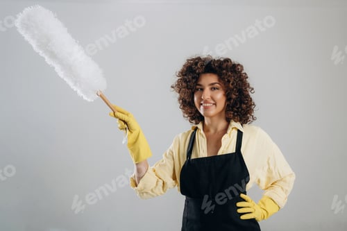 Preview: Housewife is ready to clean the house. Beautiful woman is in the studio