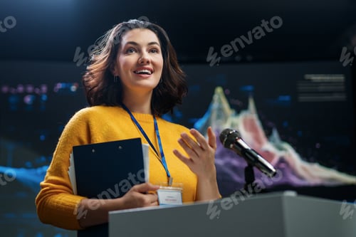Preview: woman is giving a presentation at conference