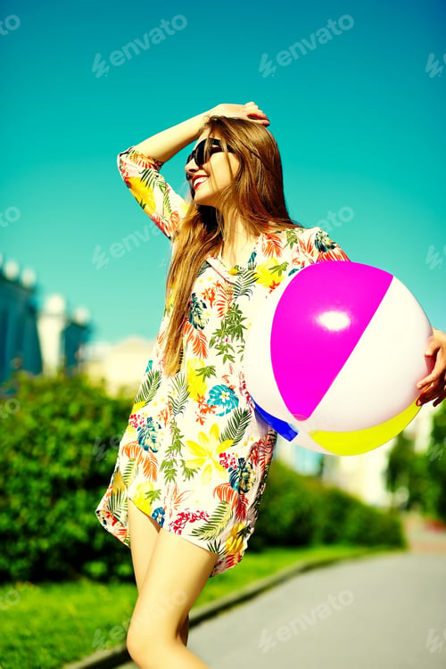 Preview: Beautiful young woman posing outdoors in summer clothes
