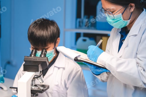 Preview: researcher working in laboratory for medicals science research using scientific equipment technology
