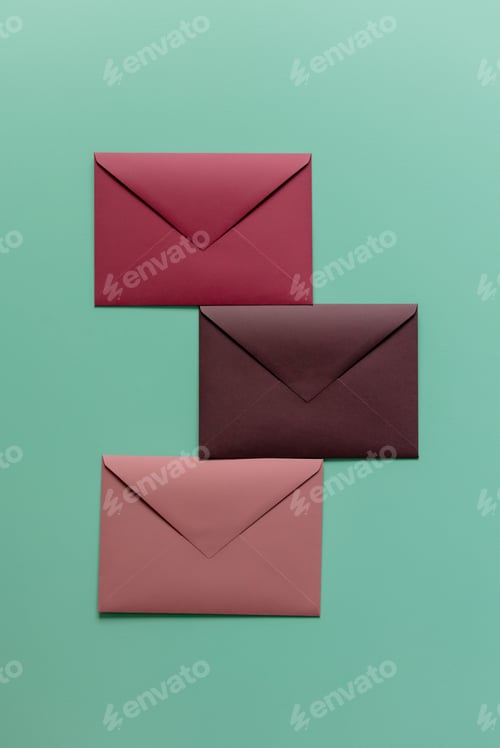 Preview: Three red envelopes on green background. Top view