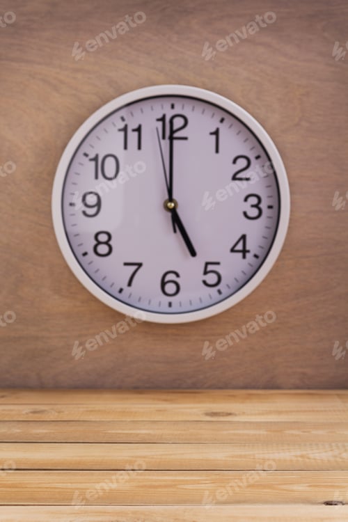 Preview: wall clock at wall near wooden table