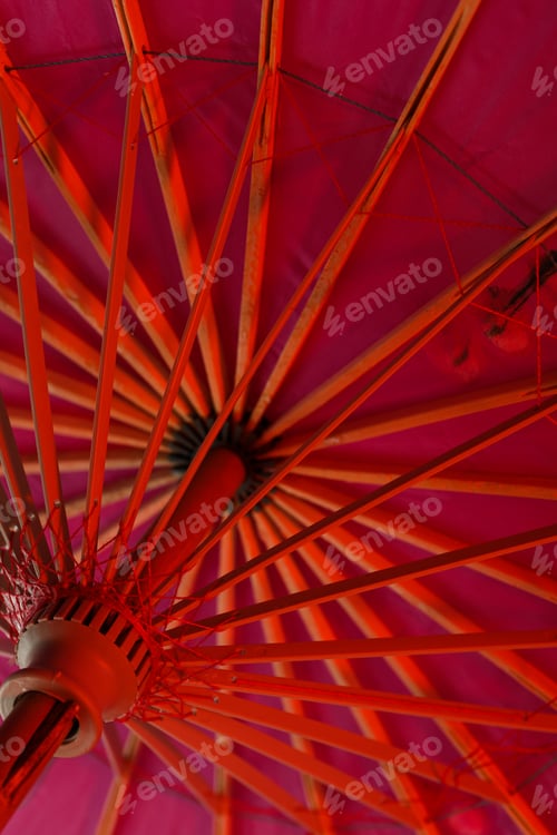Preview: A beautiful Japanese umbrella is illuminated with red light