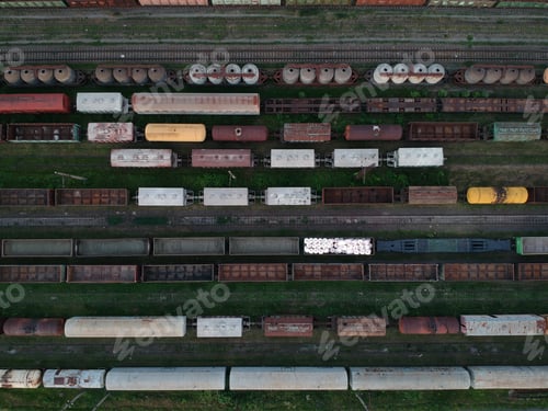 Preview: Aerial view of a cargo trains. Colorful freight trains on the railway station. Heavy industry.