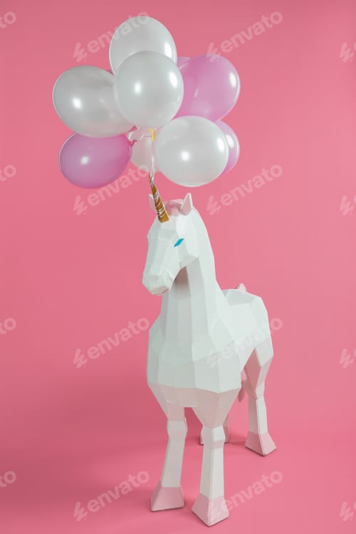 Preview: Toy unicorn under pink and white balloons on pink background