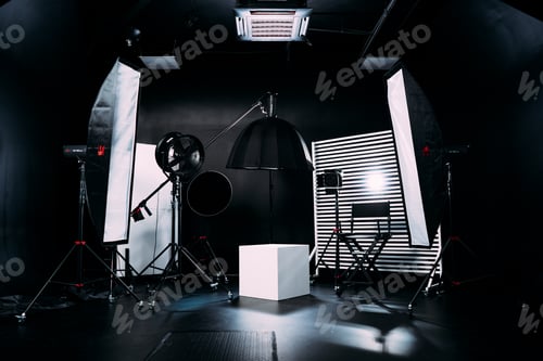Preview: Modern photo studio with professional equipment. Black cyclorama.