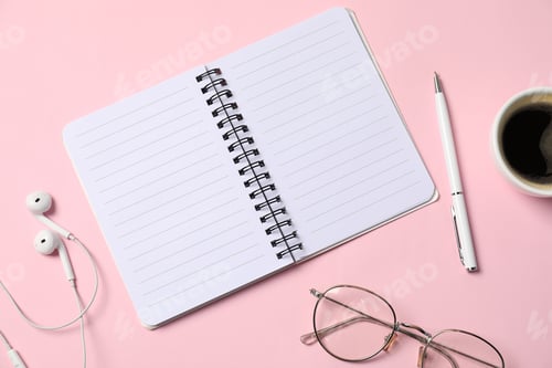 Preview: Notebook with pen, earphones, glasses and coffee on pink background, flat lay