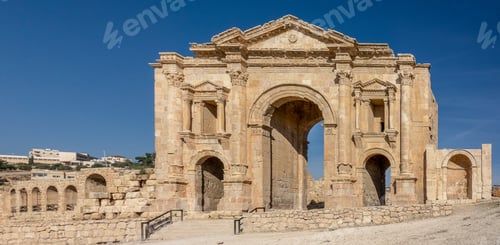 Preview: Wide angle shot of the Arch of Hadrian in Jordan under a blue sky