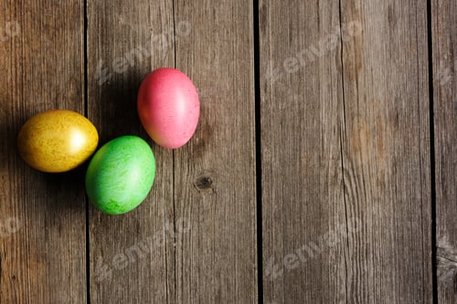 Preview: Festive Colored Easter Eggs on a Wooden Surface