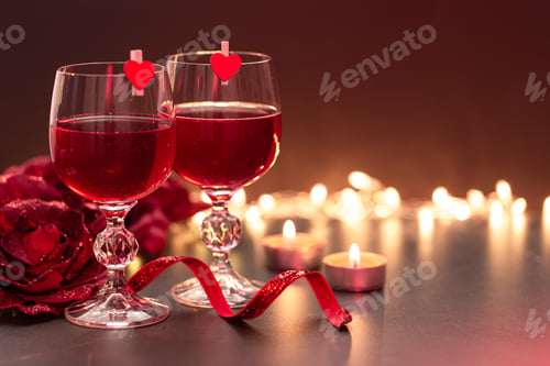 Preview: Background for Valentine's Day with glasses of wine on a blurred background.