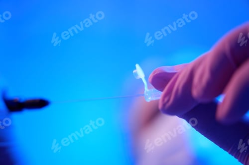 Preview: Lab researcher transferring specimens to cryogenic tube