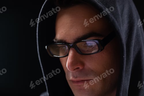 Preview: Caucasian man on black background with glasses