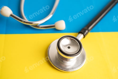 Preview: Black stethoscope on Ukraine flag background, Business and finance concept.