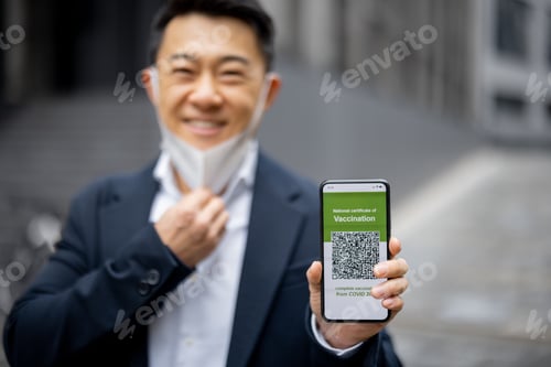 Preview: Man show phone with Coronavirus Vaccination app