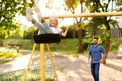 Preview: Swinging into happiness. Happy family having fun outside, father riding daughter on a swing, playing