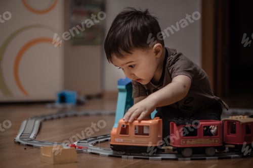 Preview: A little boy plays by train and railway