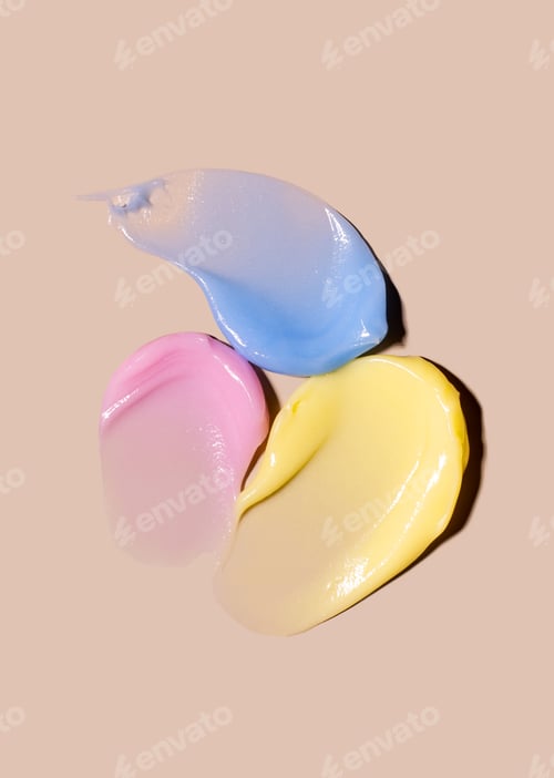 Preview: creamy texture of cosmetic samples on a pastel beige background