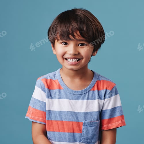 Preview: Portrait of a cute little asian boy wearing casual clothes while smiling and looking excited. Child