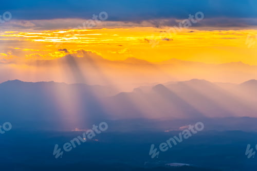Preview: Nature background. Ray light at mountain in sunset. Fantasy sky scene. Amazing nature background.